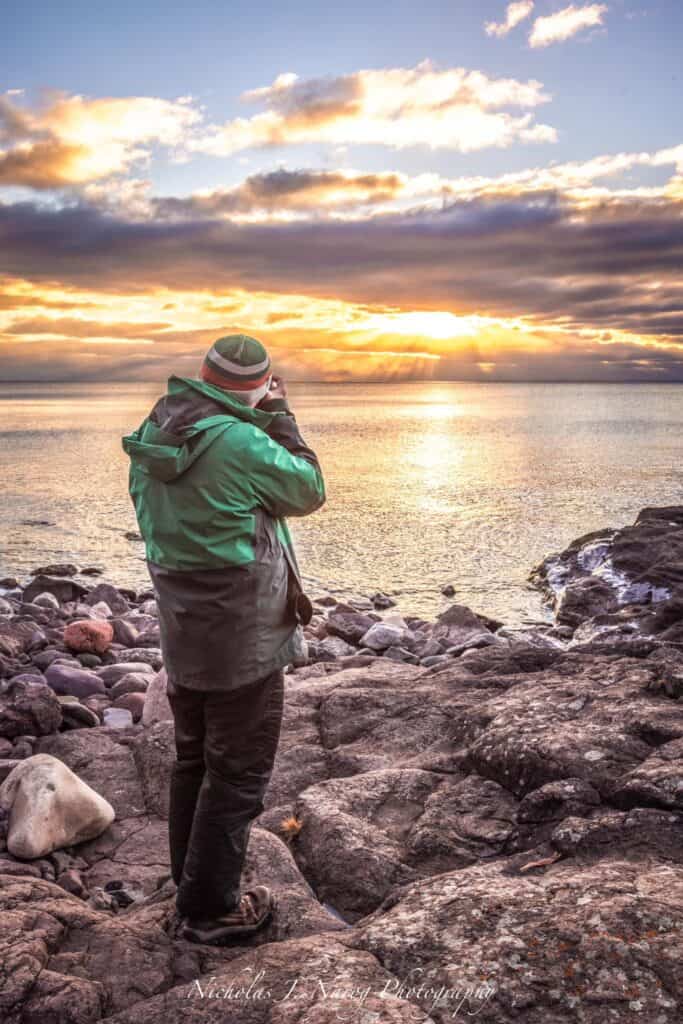 On Lake Superior writer Corey S. shooting a sunrise photo on the north shore -- Photo courtesy Nicholas J. Narog 