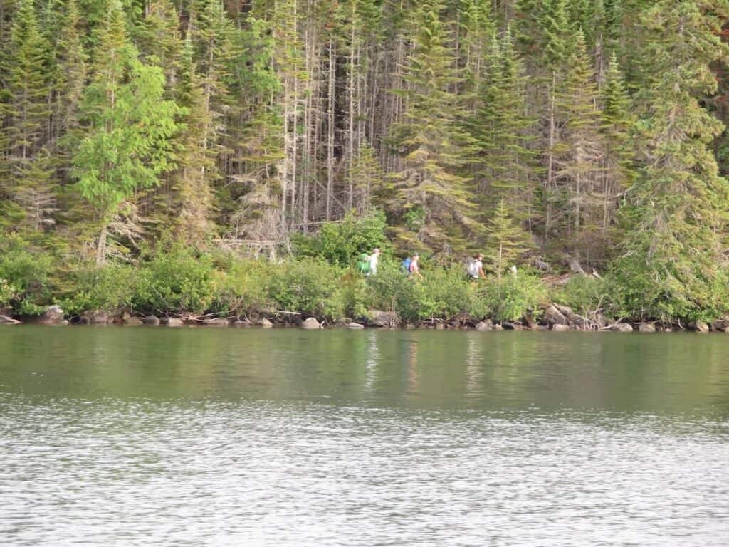hikers along shore