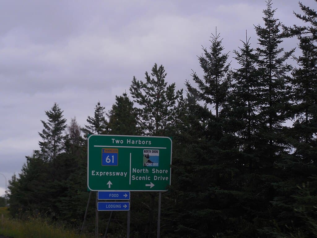A sign on Highway 61 leaving Duluth and heading toward Two Harbors showing the Expressway route and the North Shore Scenic Drive route.