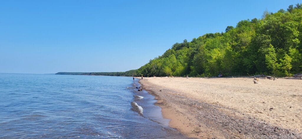 A view of the beach looking east on a sunny, summer day. 