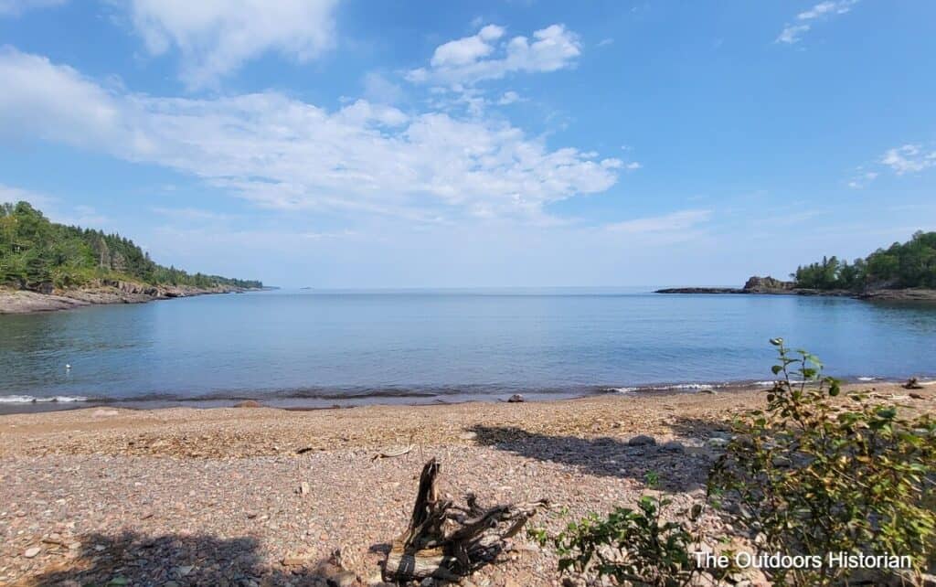 A view from the cobble shore of the cove, looking northeast over Lake Superior.