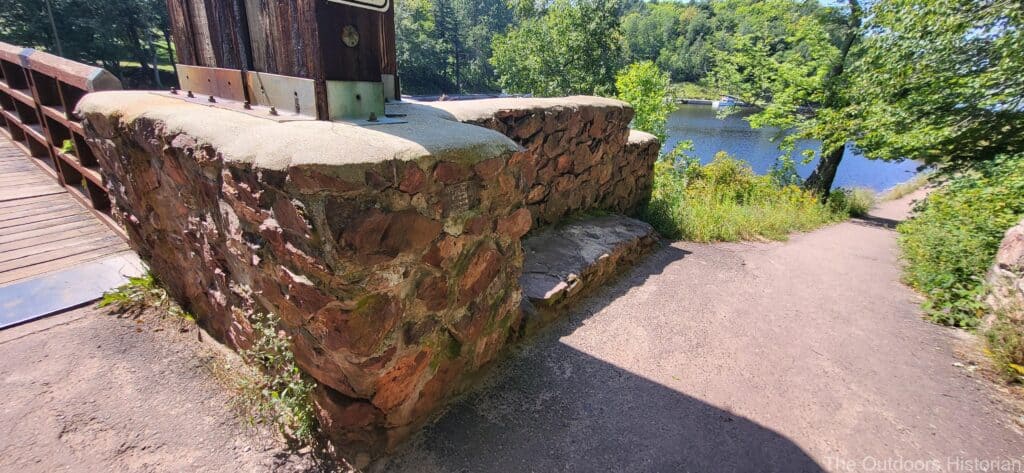 A close-up of the stonework at the base of the bridge. The stonework is typical of the CCC style. 
